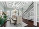 Elegant dining room featuring coffered ceilings, wainscoting, and hardwood floors at 900 Berwick Ln., Myrtle Beach, SC 29579