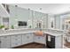 Open-concept kitchen with granite countertops, a copper sink, modern fixtures, and seamless flow to the living area at 900 Berwick Ln., Myrtle Beach, SC 29579