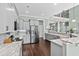 Modern kitchen with gray cabinets, granite counters, and stainless steel appliances at 900 Berwick Ln., Myrtle Beach, SC 29579