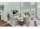 Beautiful living room featuring high ceilings, fireplace, and natural light at 900 Berwick Ln., Myrtle Beach, SC 29579