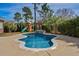 Sparkling in-ground pool with a rock waterfall and an adjacent ' playset at 900 Berwick Ln., Myrtle Beach, SC 29579