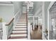 Elegant staircase leading to the second floor with views into the living space at 900 Berwick Ln., Myrtle Beach, SC 29579