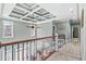 This is the upstairs hallway with unique ceiling and ceiling fan. The hallway railing overlooks the living room at 900 Berwick Ln., Myrtle Beach, SC 29579