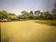 Scenic driveway leading to the clubhouse among lush green landscaping at 9820 Queensway Blvd. # 1502, Myrtle Beach, SC 29572