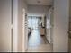 Hallway view into bedroom with desk and a spectacular view from a balcony at 9820 Queensway Blvd. # 1502, Myrtle Beach, SC 29572