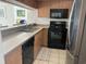 Kitchen with stainless steel refrigerator and black dishwasher, oven, and microwave at 9820 Queensway Blvd. # 1502, Myrtle Beach, SC 29572