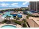 Aerial view showing multiple pools, the beach, the ocean, and blue skies at 100 North Beach Blvd. # 506, North Myrtle Beach, SC 29582