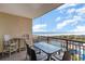 This balcony view shows seating, tables, and a beautiful ocean view with blue sky at 100 North Beach Blvd. # 506, North Myrtle Beach, SC 29582