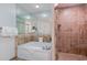 Spa-like bathroom with a bathtub, tiled shower, and modern fixtures at 100 North Beach Blvd. # 506, North Myrtle Beach, SC 29582