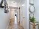 Hallway with tile floors and decorative mirrors and console table with flowers at 100 North Beach Blvd. # 506, North Myrtle Beach, SC 29582