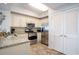 Kitchen featuring stainless steel appliances, light colored cabinets and tiled floors at 100 North Beach Blvd. # 506, North Myrtle Beach, SC 29582
