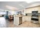 Open concept kitchen with granite countertops and stainless steel appliances open to the dining area at 100 North Beach Blvd. # 506, North Myrtle Beach, SC 29582