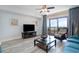 Comfortable living room with a large TV, a decorative bowl, and a balcony at 100 North Beach Blvd. # 506, North Myrtle Beach, SC 29582