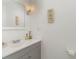 White bathroom with gray vanity and plenty of natural light at 1025 Carolina Rd. # Cc2, Conway, SC 29526