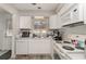 Modern kitchen featuring white cabinets, stainless steel appliances, hardwood floors, and plenty of natural light at 1025 Carolina Rd. # Cc2, Conway, SC 29526