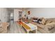 Bright open living room, dining area with hardwood floors, chandelier and lots of natural light at 1025 Carolina Rd. # Cc2, Conway, SC 29526