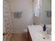 Cozy bathroom featuring a vanity with a sink, a toilet, and a bathtub with a decorative shower curtain at 1027 Pinwheel Loop # 3103, Myrtle Beach, SC 29577