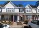 Charming townhouse exterior with brick accents, blue shutters, and an American flag at 1027 Pinwheel Loop # 3103, Myrtle Beach, SC 29577