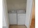 Laundry area includes a washer and dryer behind folding doors with neutral colored flooring at 1027 Pinwheel Loop # 3103, Myrtle Beach, SC 29577