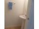 Powder room with a pedestal sink, mirror, towel bar, and light peach tile flooring at 1027 Pinwheel Loop # 3103, Myrtle Beach, SC 29577