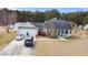 Aerial view of home with two car garage, well manicured yard and long driveway with room to park multiple vehicles at 113 Cat Tail Bay Dr., Conway, SC 29527
