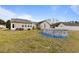 Spacious backyard featuring an above-ground pool, a patio area, and a well-maintained lawn at 113 Cat Tail Bay Dr., Conway, SC 29527