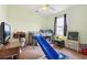 Cozy bedroom with hardwood floors, ceiling fan, and a lofted bed with a slide for play at 113 Cat Tail Bay Dr., Conway, SC 29527