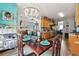 Open concept dining room featuring wood floors, dining table, and view to living room and kitchen at 113 Cat Tail Bay Dr., Conway, SC 29527