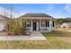 Charming single-story home features a cozy front porch with black shutters and a walkway leading to the entrance at 113 Cat Tail Bay Dr., Conway, SC 29527
