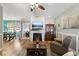 Cozy living room flows into the dining area, with a decorative fireplace and laminate floors for a warm and inviting ambiance at 113 Cat Tail Bay Dr., Conway, SC 29527