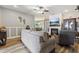 Bright living room features gray walls, an inviting fireplace, and view into the dining area, and attractive laminate flooring at 113 Cat Tail Bay Dr., Conway, SC 29527