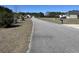 Peaceful neighborhood road lined with mailboxes and green spaces at 113 Cat Tail Bay Dr., Conway, SC 29527