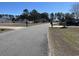 Quiet residential street with well-maintained lawns and mature trees at 113 Cat Tail Bay Dr., Conway, SC 29527