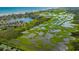 Expansive aerial view of waterfront properties with stunning wetlands and marsh views at 118 Ellington Ln., Pawleys Island, SC 29585