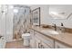 Bright bathroom with a granite vanity and decorative mirror at 118 Ellington Ln., Pawleys Island, SC 29585