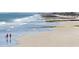 A serene beach scene with families enjoying the coastline and ocean waves at 118 Ellington Ln., Pawleys Island, SC 29585