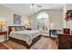 Comfortable bedroom with a large window, hardwood floors, and a cozy decor at 118 Ellington Ln., Pawleys Island, SC 29585