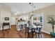 Bright dining area features a glass table, a window, and bar seating at 118 Ellington Ln., Pawleys Island, SC 29585