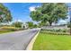 Welcoming entrance to Millbrook Plantation with beautifully landscaped grounds and a charming guard house at 118 Ellington Ln., Pawleys Island, SC 29585