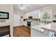 Well-lit kitchen equipped with white cabinetry and modern appliances at 118 Ellington Ln., Pawleys Island, SC 29585