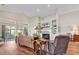 Inviting living room with a vaulted ceiling, fireplace, and lots of natural light at 118 Ellington Ln., Pawleys Island, SC 29585
