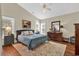 Cozy main bedroom with a plush bed, hardwood floors, and ample natural light at 118 Ellington Ln., Pawleys Island, SC 29585