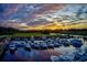 Tranquil marina with a beautiful sunset and sky full of boats docked and ready for the water at 118 Ellington Ln., Pawleys Island, SC 29585