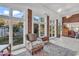 Bright sunroom with large windows overlooking the backyard at 118 Ellington Ln., Pawleys Island, SC 29585
