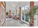 Inviting sun room with brick accents and large windows offering natural light at 118 Ellington Ln., Pawleys Island, SC 29585