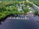 Aerial view of homes close to water with multiple boat slips at 125 Harbor Oaks Dr., Myrtle Beach, SC 29588