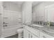 Clean bathroom with a tub-shower combo, granite vanity, and white cabinetry at 125 Harbor Oaks Dr., Myrtle Beach, SC 29588