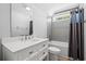 Contemporary bathroom features a shower-tub combo with gray tiling, single vanity, and light wood floor at 125 Harbor Oaks Dr., Myrtle Beach, SC 29588