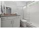 Bright bathroom with white cabinets, granite countertop, and a glass-enclosed shower at 125 Harbor Oaks Dr., Myrtle Beach, SC 29588