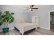 Neutral bedroom with a comfortable queen bed, ceiling fan, and a light-colored wood laminate floor at 125 Harbor Oaks Dr., Myrtle Beach, SC 29588